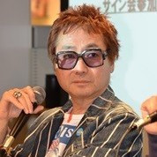 Tosh at the microphone